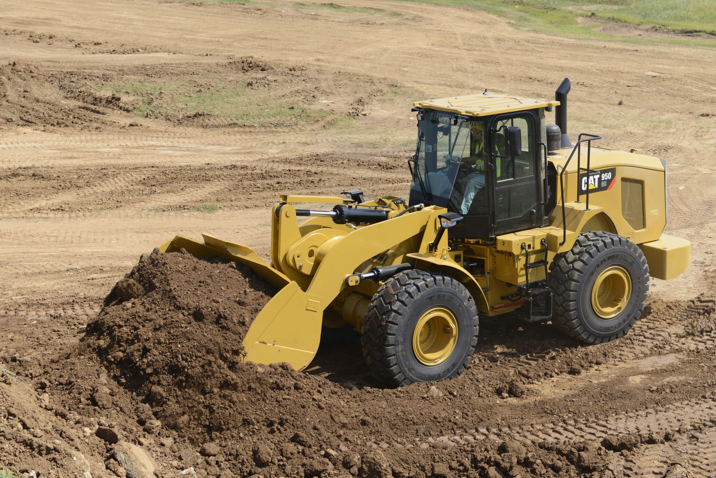 Cat Machines clear dirt for motocross