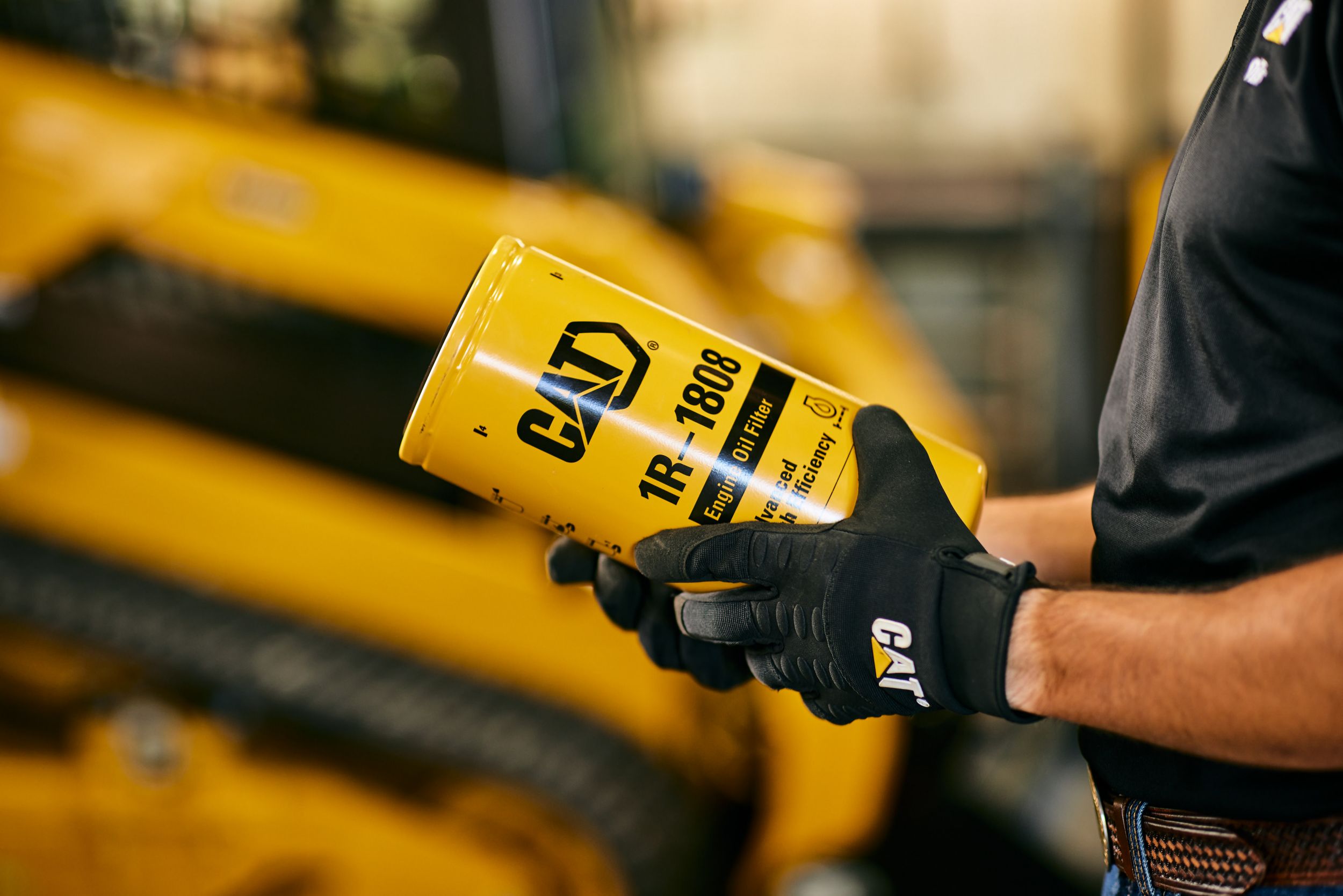 Man Holding Engine OIl FIlter