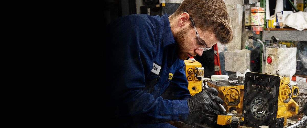 Dealer works on a Cat pump