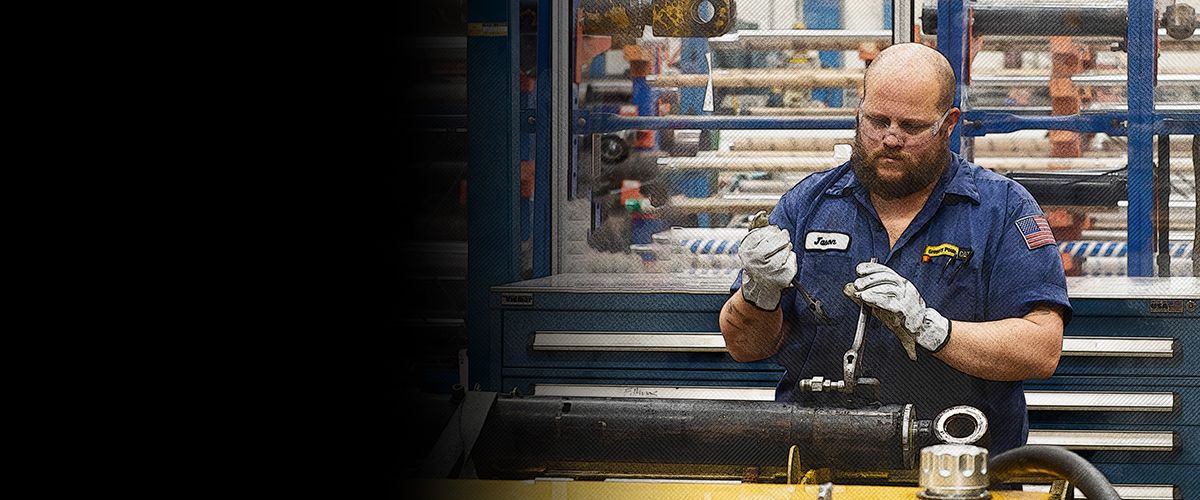 Dealer working on a Cat Cylinder