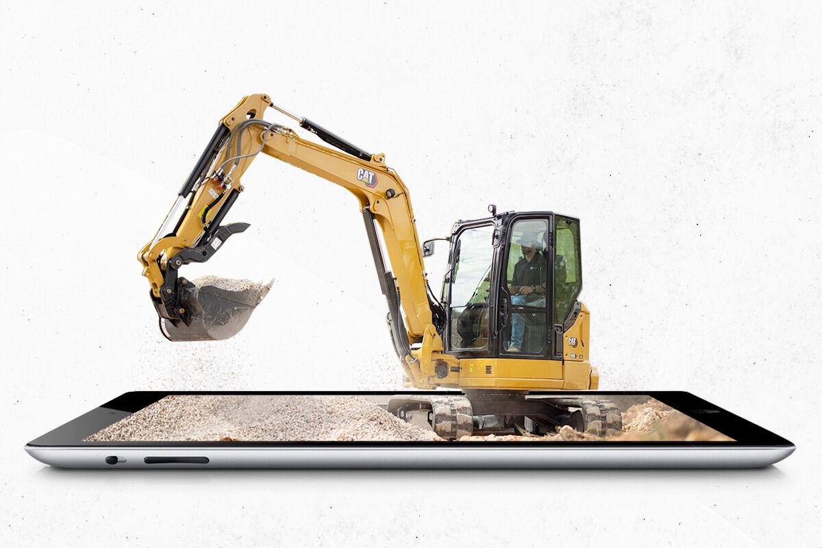 Mini excavator coming out of a tablet