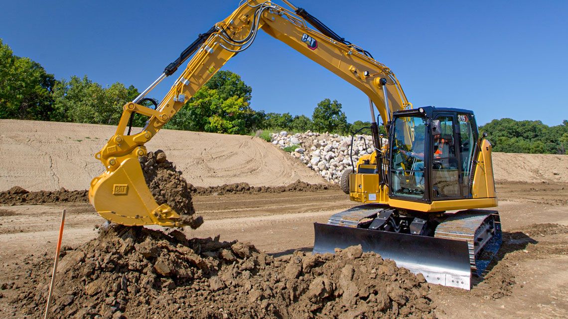 Excavator picking up dirt on a jobsite