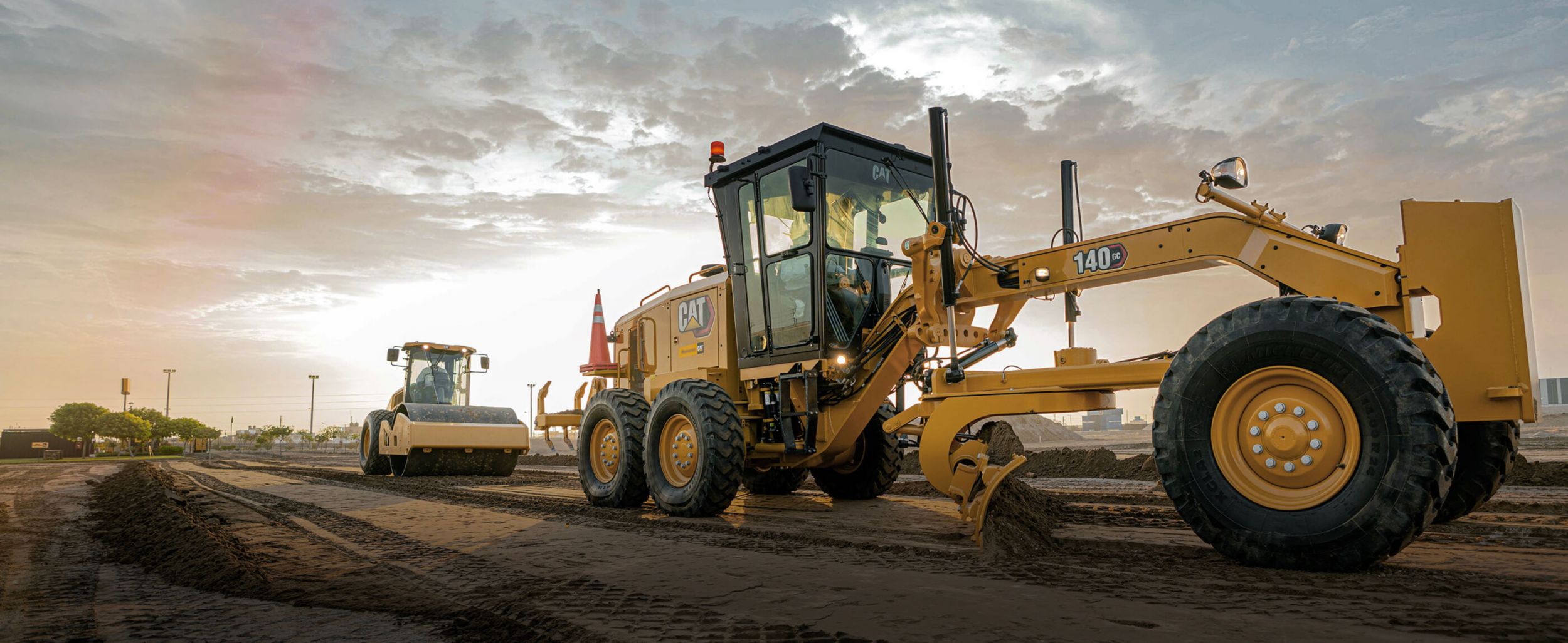 140GC Cat Motor Grader with nice clouds in the background
