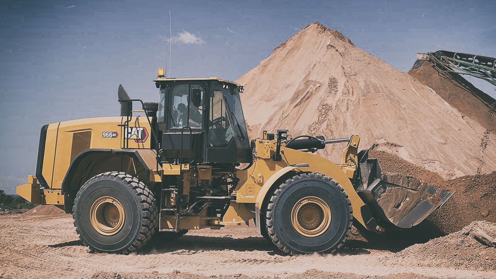 966 GC Wheel Loader lifting dirt on jobsite