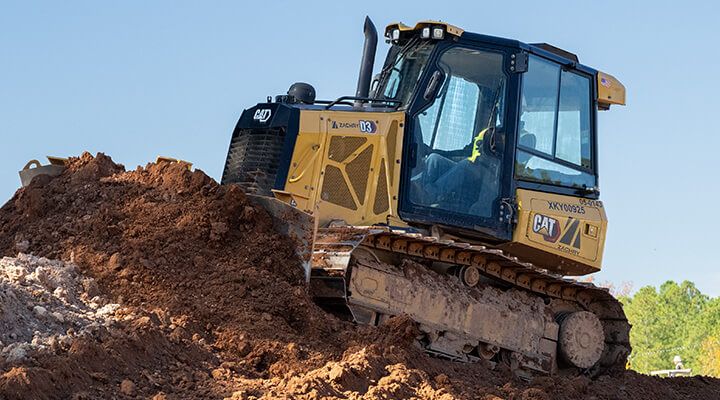 D3 dozer on job site on mound of dirt