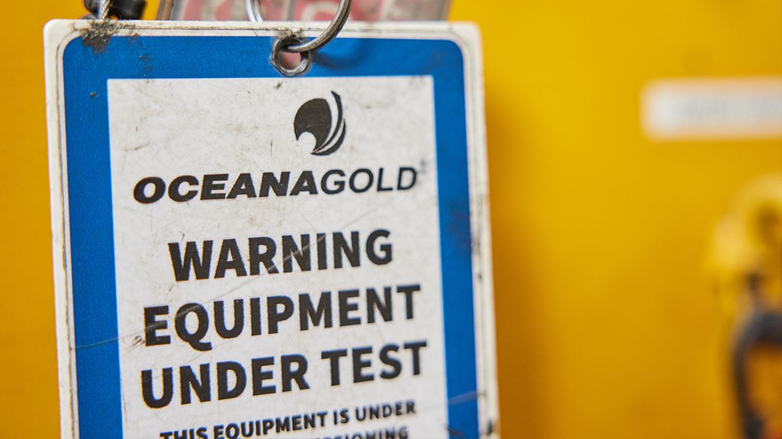 "OceanaGold Warning Equipment Under Test" blue tag 