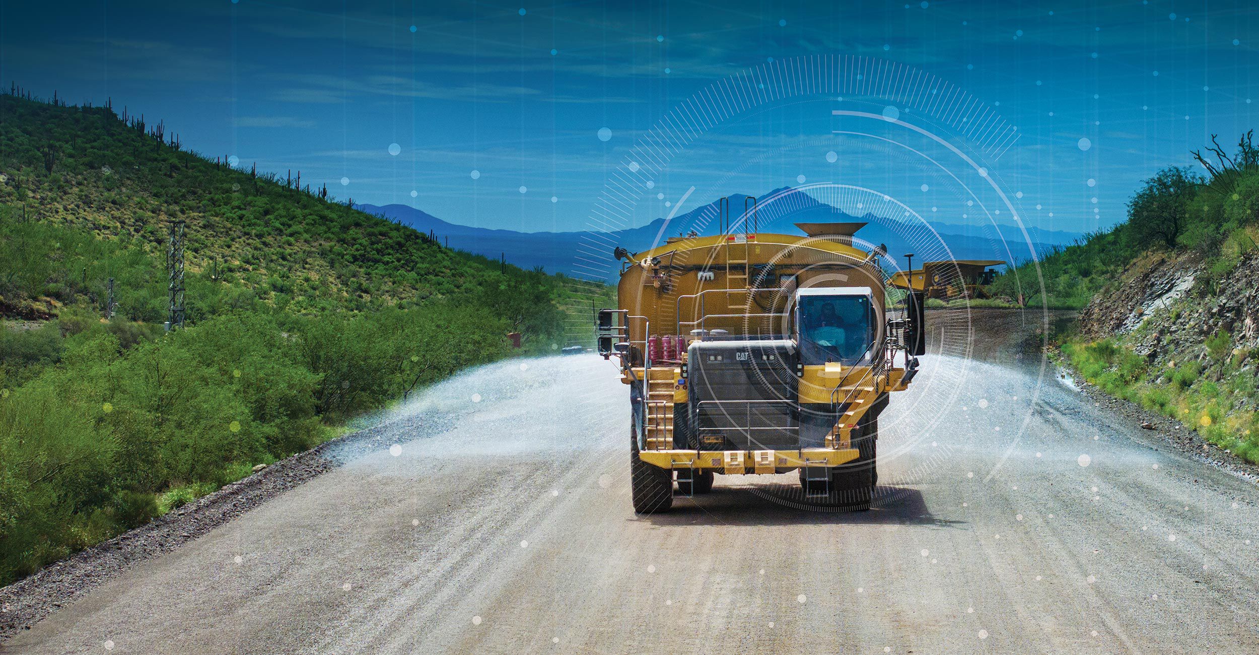 Water truck with 794s in bakground